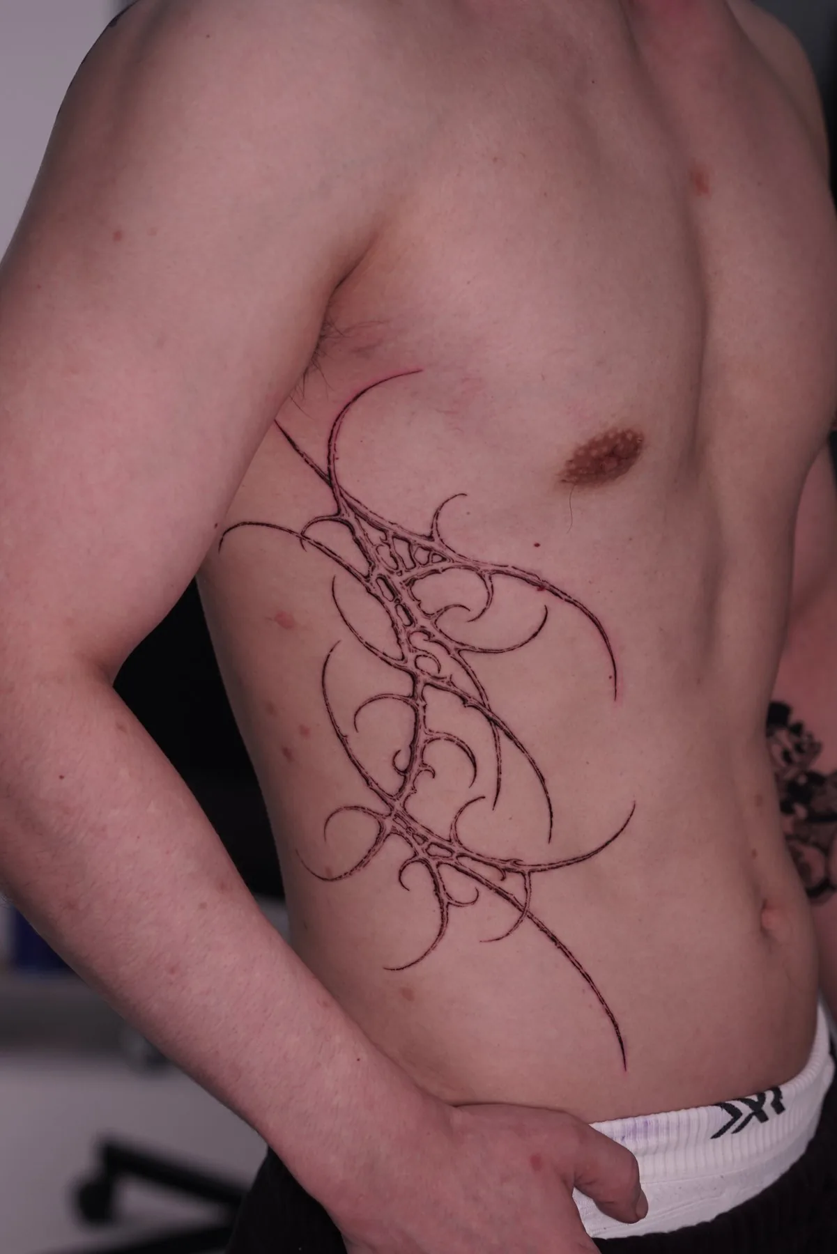 Abstract / Torso tattoo on the torso by Moussa in Shanghai
