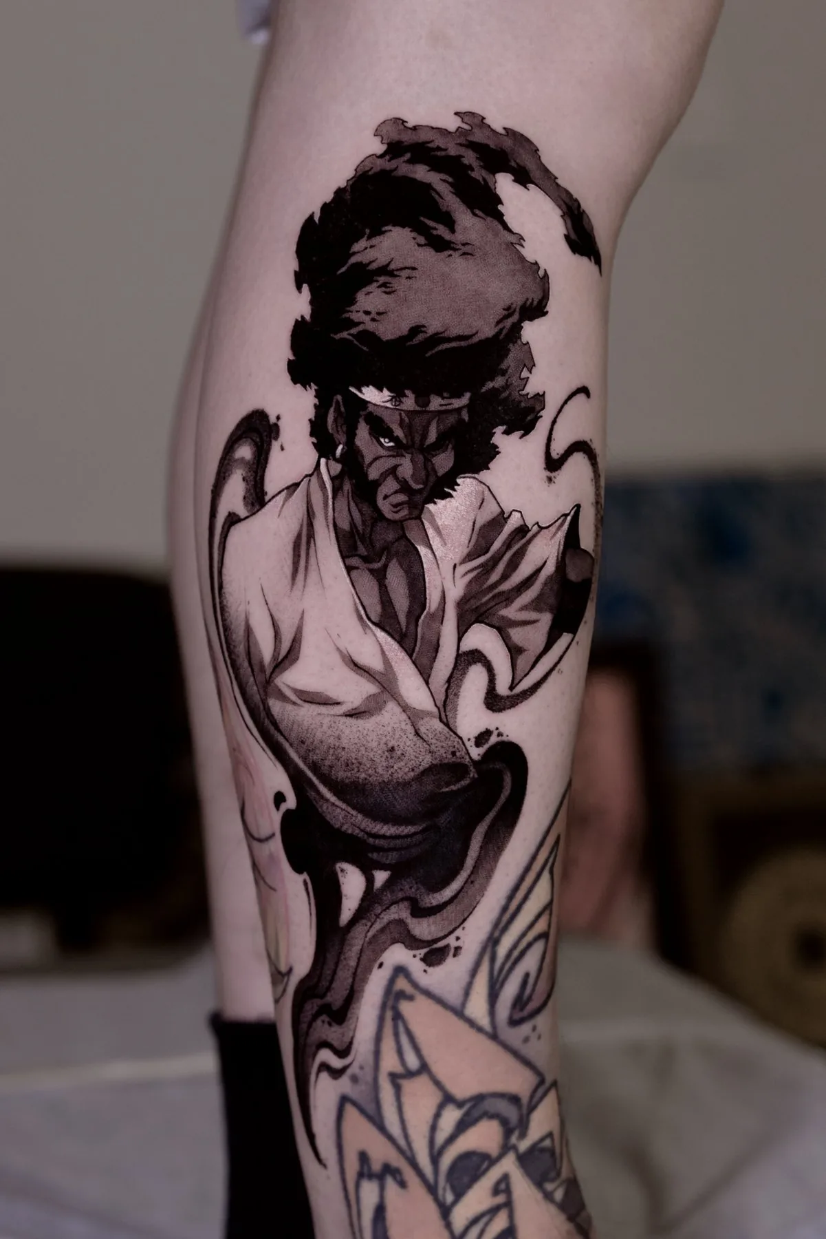 Afro / Graphic tattoo on the arm by Moussa in Shanghai