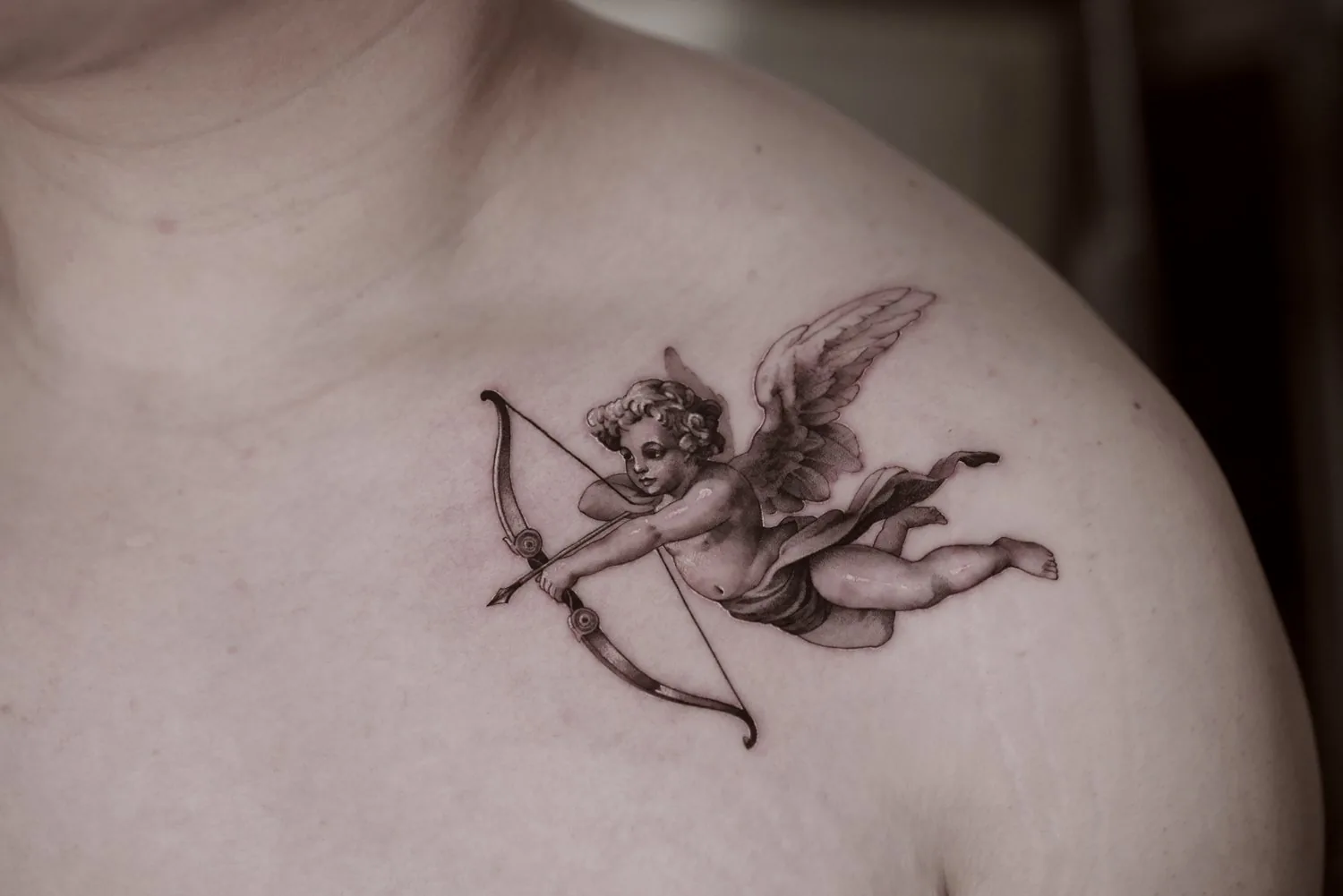 Cupid / Fine Detail tattoo on the chest by Moussa in Shanghai