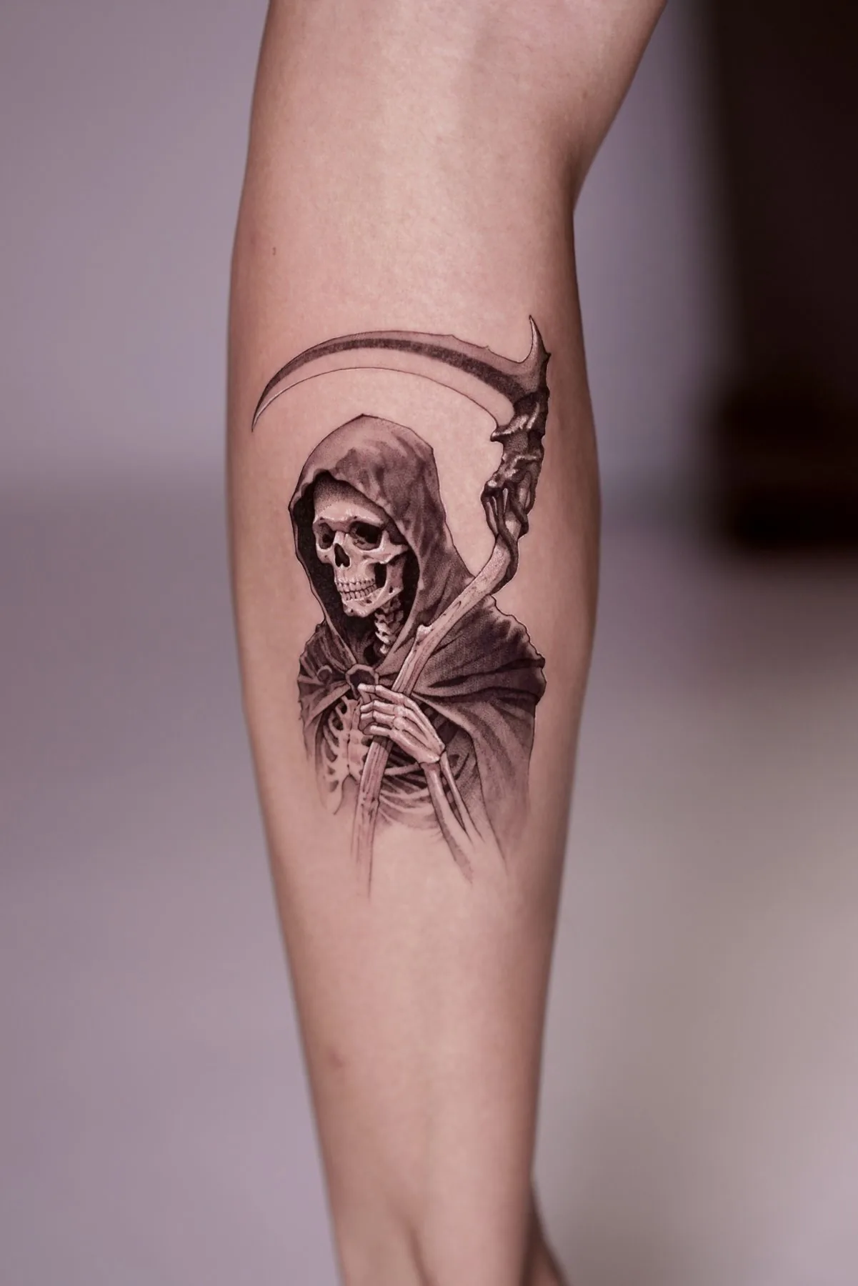 Grim Reaper tattoo on the arm by Moussa in Shanghai