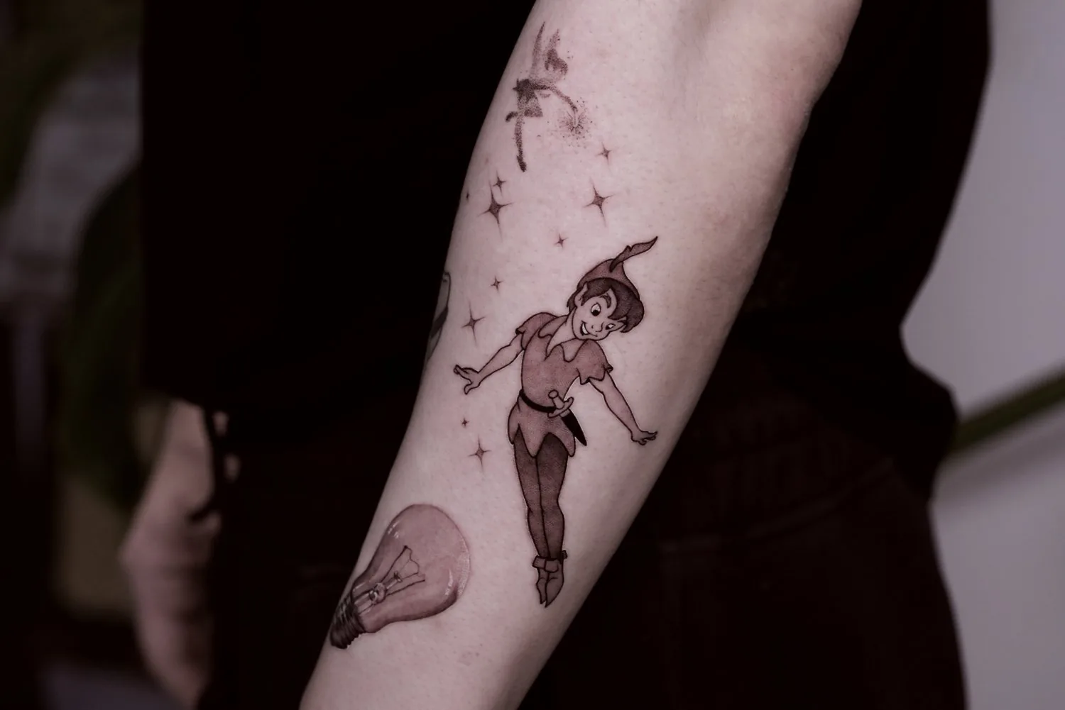 Peter Pan tattoo on the arm by Moussa in Shanghai