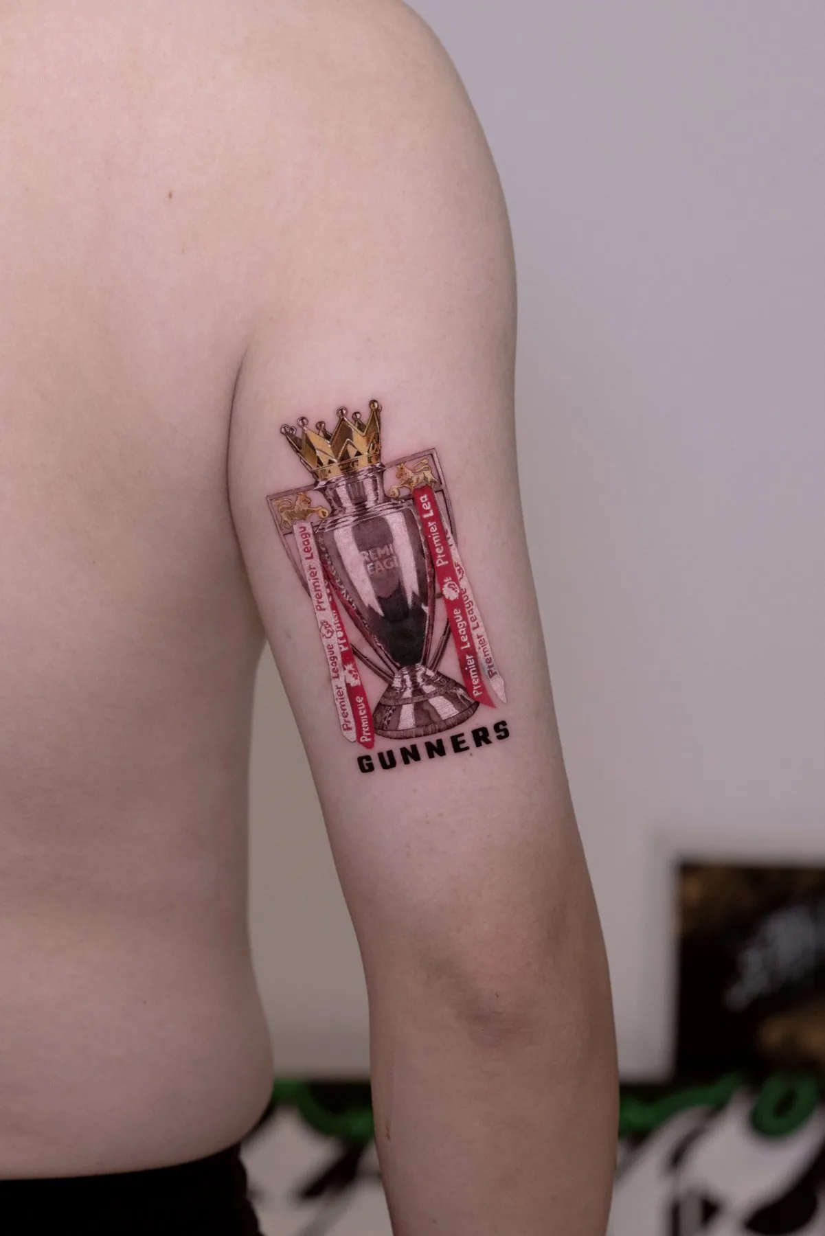 Trophy / Colour Detail tattoo on the arm by Moussa in Shanghai