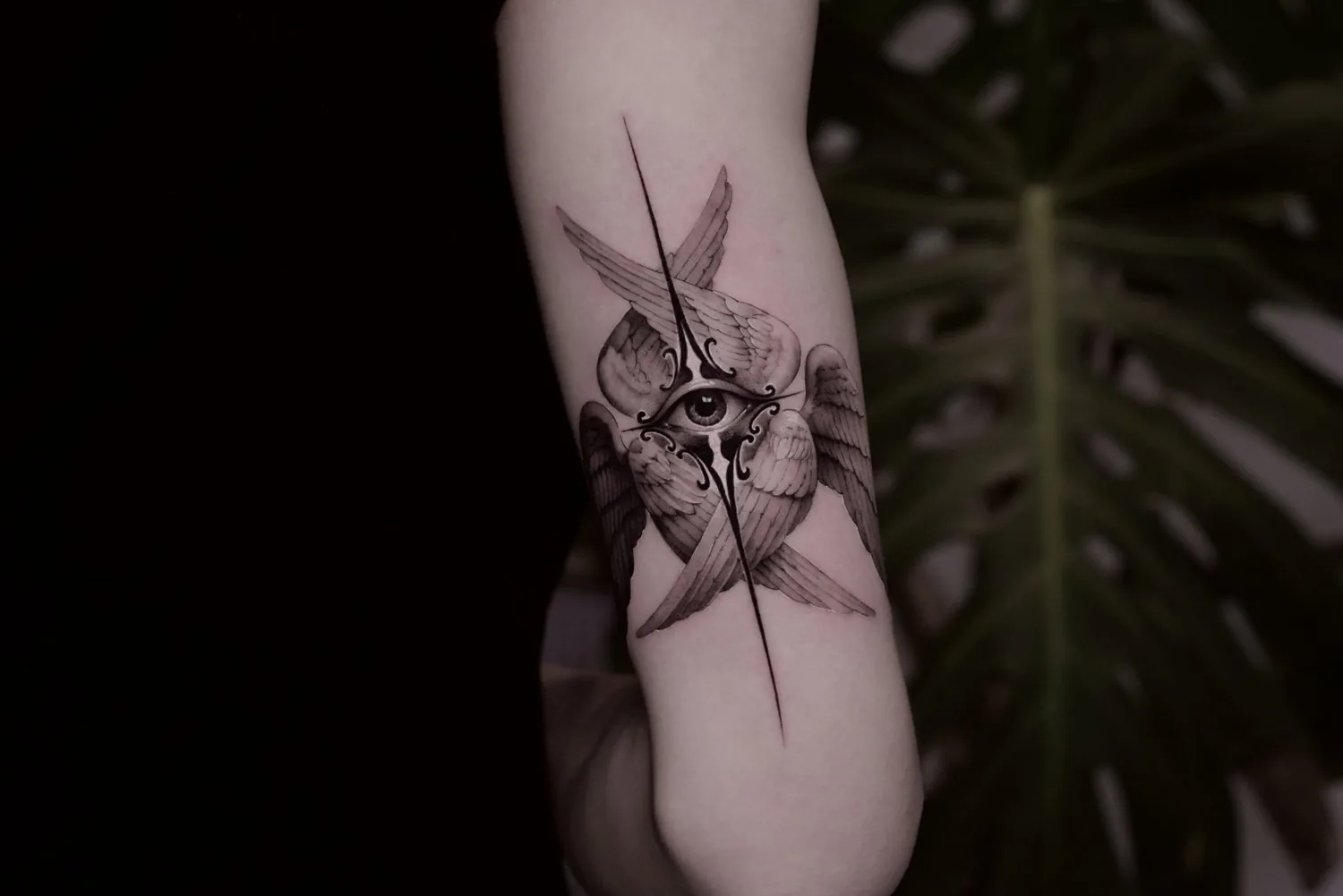 Winged Eye tattoo on the arm by Moussa in Shanghai